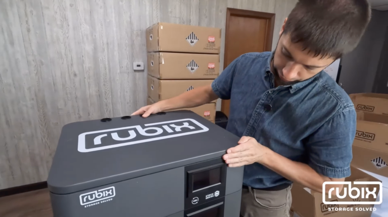 man installing rubix battery lid