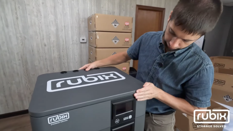 man installing rubix battery lid